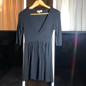 Shirt dress black with quarter length sleeves formfitting.